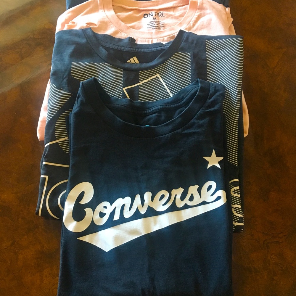 Bundle of 4 medium sized women/teen t-shirts